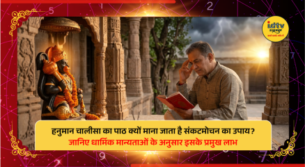 Devotee reciting Hanuman Chalisa before Lord Hanuman idol with a lit diya during prayer.